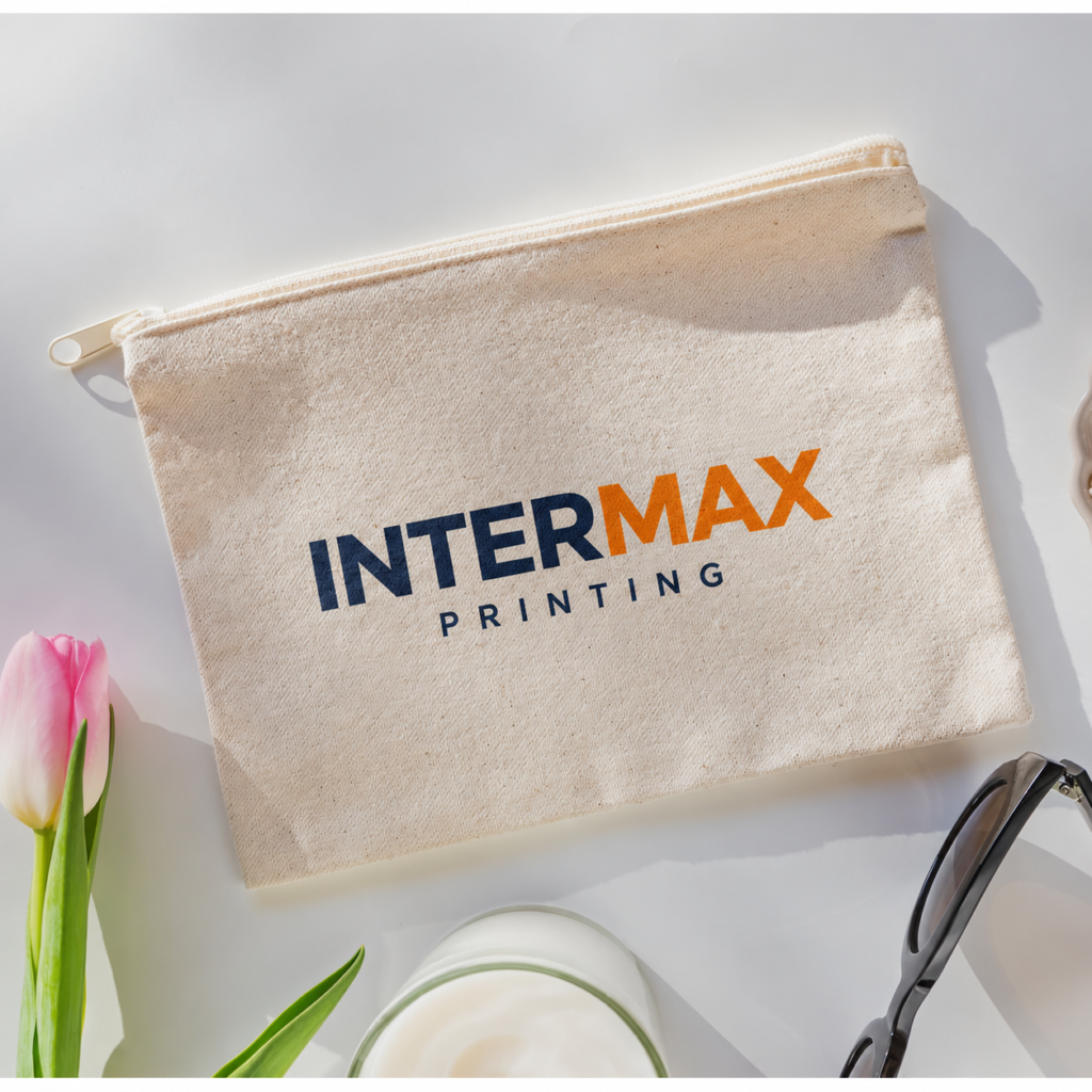 Cream fabric pouch with a zipper and Intermax Printing logo